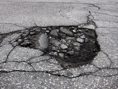 What Potholes Can Do to Your Car